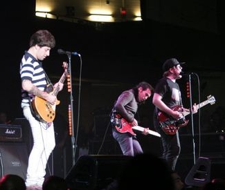 Fall Out Boy performing in 2006. Drummer Andy Hurley is not visible.